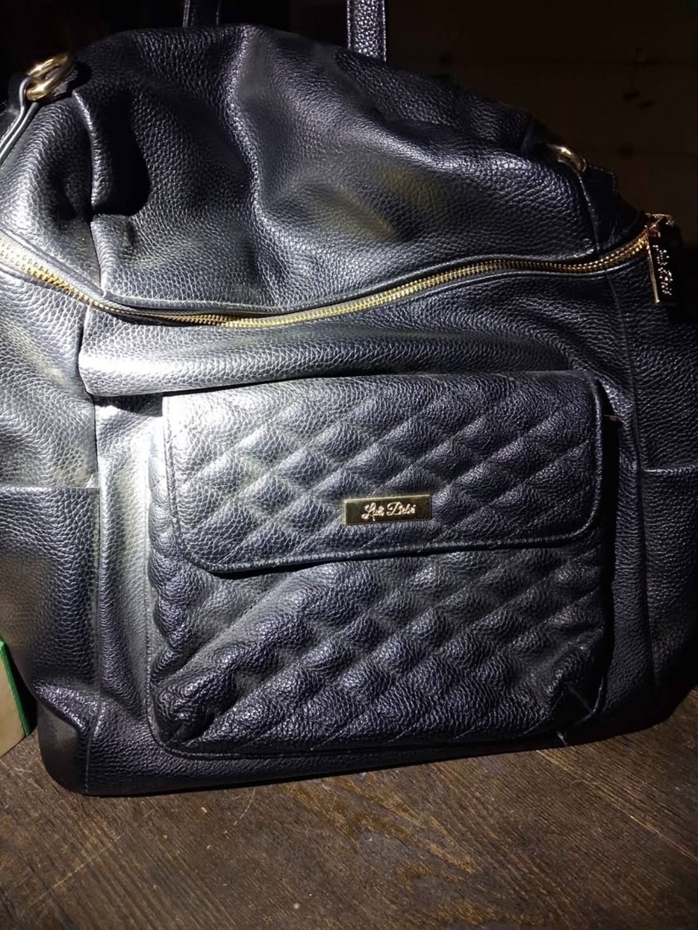 Quilted Front Black Leather Backpack with Gold Accents
